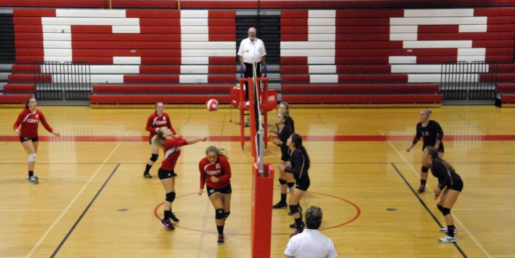 Staff photo by Joe Phelan
Cony, left, returns a shot from Gorham during a game Thursday at Cony High School in Augusta.