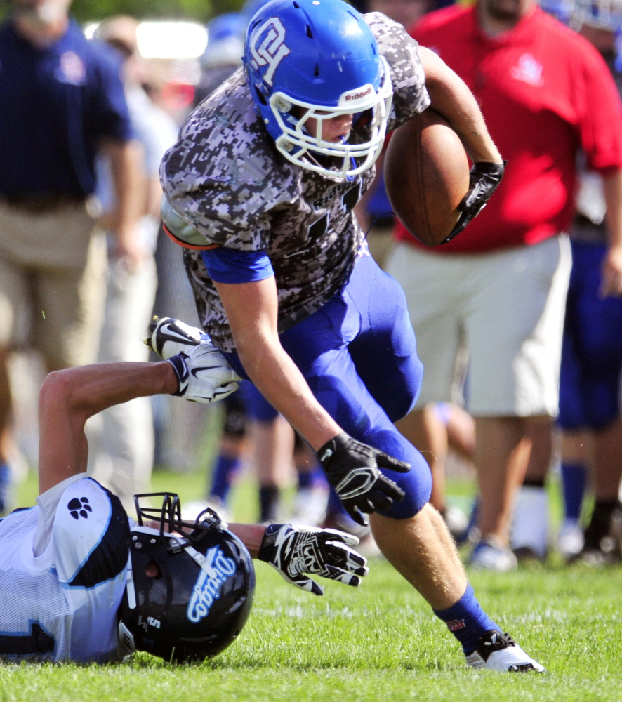 Oak Hill’s Jonah Martin scores a touchdown against Dirigo on Saturday in Wales.