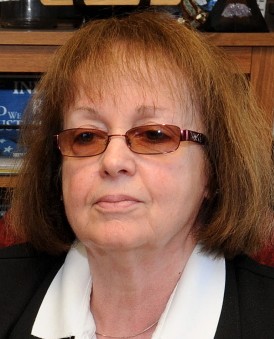 Claudia Viles sits at her desk at the town office in Anson in this file photo. The town’s tax collector for 42 years resigned Thursday after selectmen told her she couldn’t handle money anymore, because the Maine Municipal Association, which handles the town’s insurance, can’t bond her.