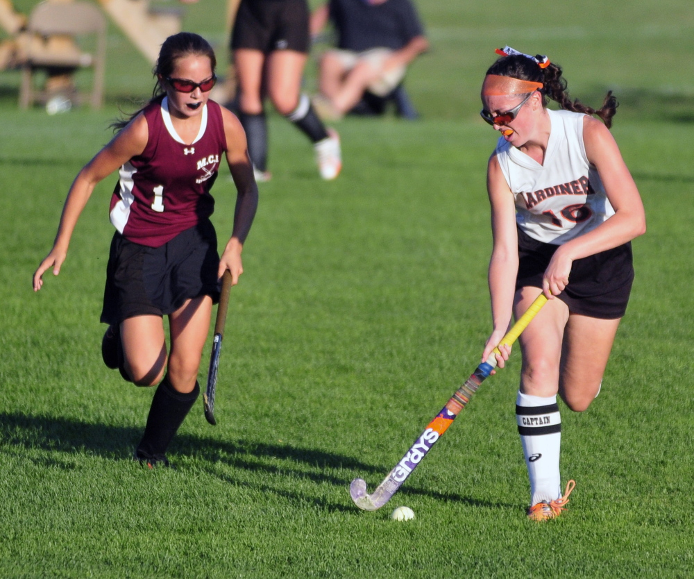 Staff photo by Joe Phelan
Maine Central Institute’s Madison Hartley, left, chases Gardiner’s Bryce Smith during a Kennebec Valley Athletic Conference Class B game Thursday on Somerville Field in Gardiner.