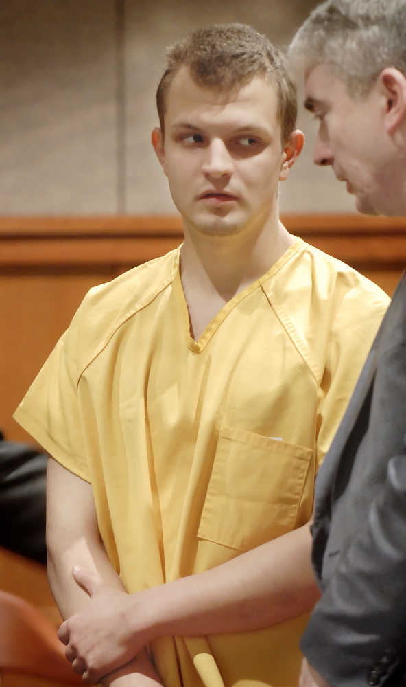 Kristian McKay appears in court with defense attorney Neal Duffet on charges of stabbing his father to death in Standish in this March 2007 file photo.