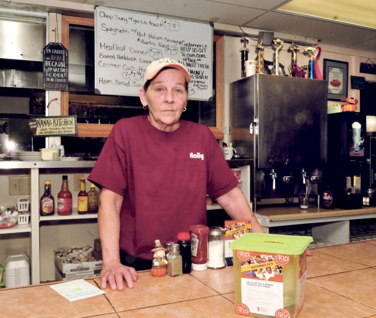 Holly Stebbins stands behind the counter inside her Holly and Doug’s Country Diner in Norridgewock on Wednesday. Thieves stole $600 early Monday morning, the second theft this year. Monday’s take included $80 from a donation jar for the No Kid Hungry organization.