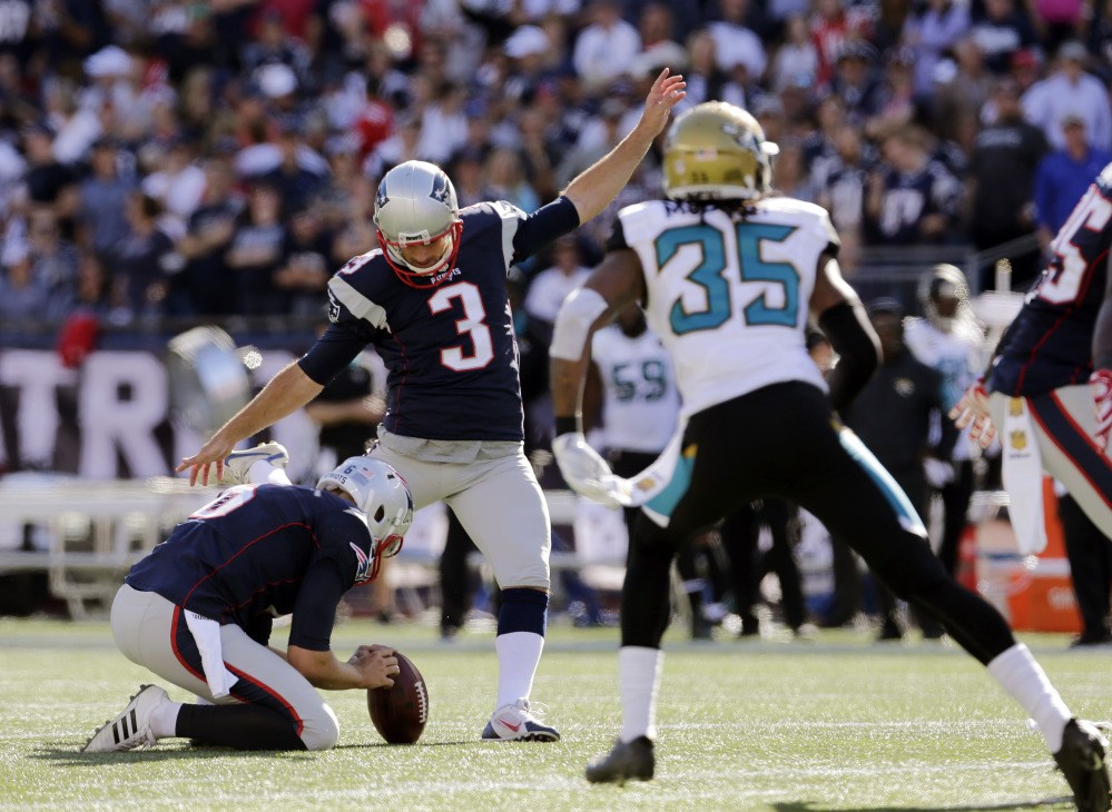 New England Patriots kicker Stephen Gostkowski (3) kicks his 423rd consecutive point after a touchdown to set a new NFL record in the second half against the Jacksonville Jaguars on Sunday in Foxborough, Mass.