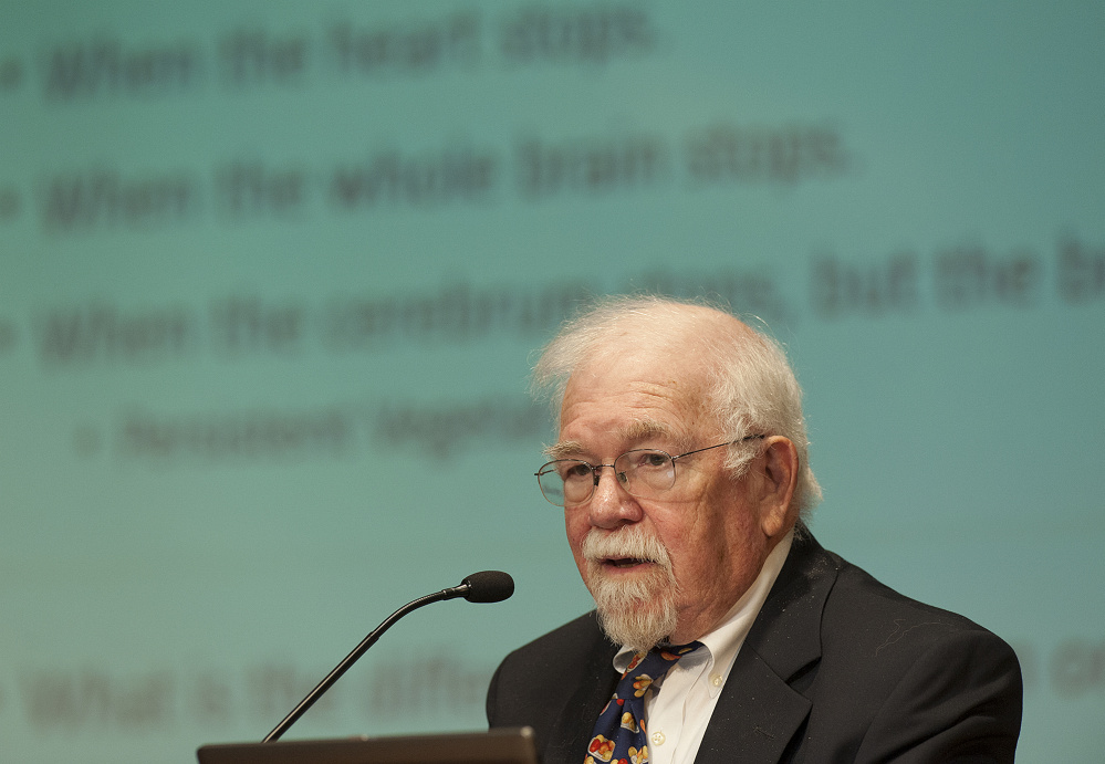 Dr. Tom Feagin speaks to a group of people about end-of-life care during a public forum at Jewet Auditorium at the University of Maine in Augusta on Sunday.