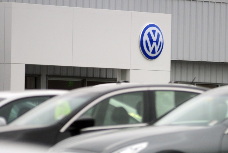 The Volkswagen logo appears Tuesday at O’Connor Volkswagen in Augusta. The dealership’s general manager, Chris Crowell, said the car manufacturer’s stop sale order affects more than half of his inventory.