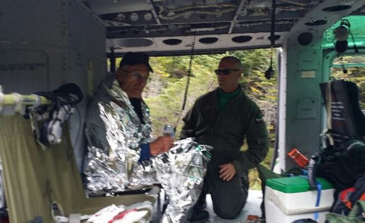 John Lyon of Dumfries, Va., sits in a helicopter after being rescued in Baxter State Park on Sunday. He had been missing since Thursday. He was treated Monday for a partially collapsed lung that he suffered when he fell and hit his chest.