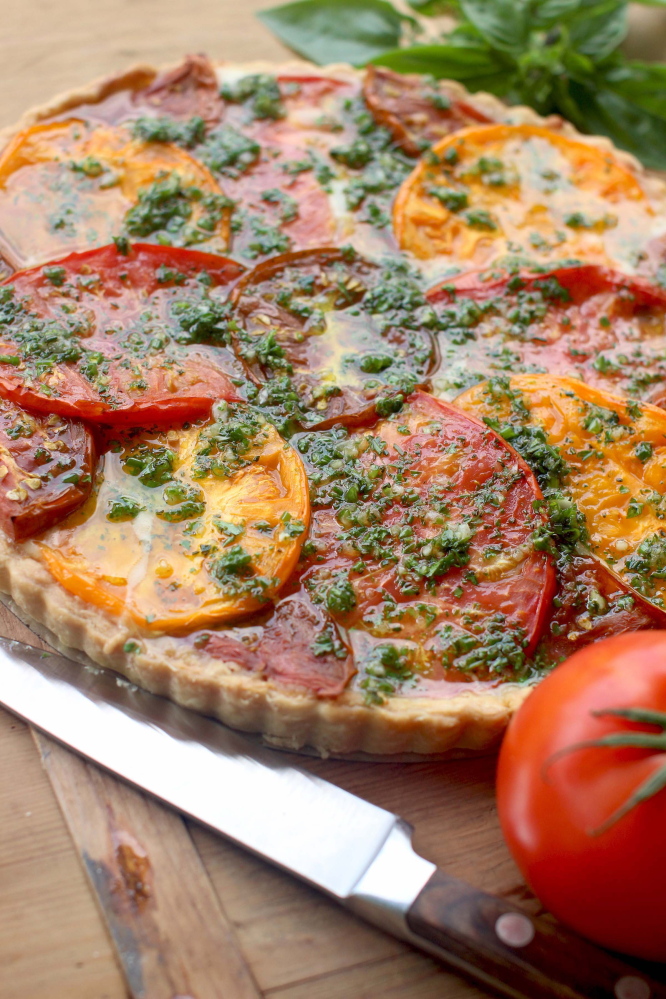 A tomato tart with Gruyere and herbs.