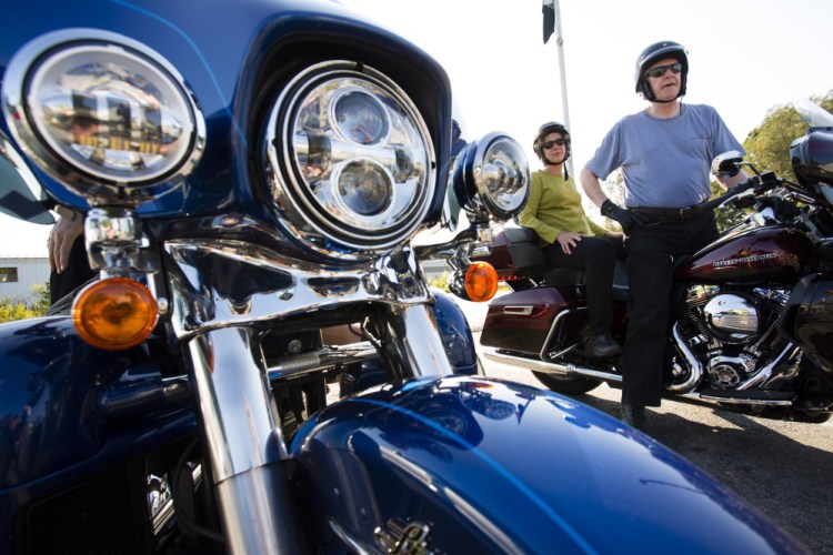 Darlene and Jay Seaton of New Hampshire talk about motorcycle safety Monday at Big Moose Harley-Davidson in Portland. “I trust Jay, but I worry about the cars pulling out in front of us,” Darlene Seaton said. Derek 