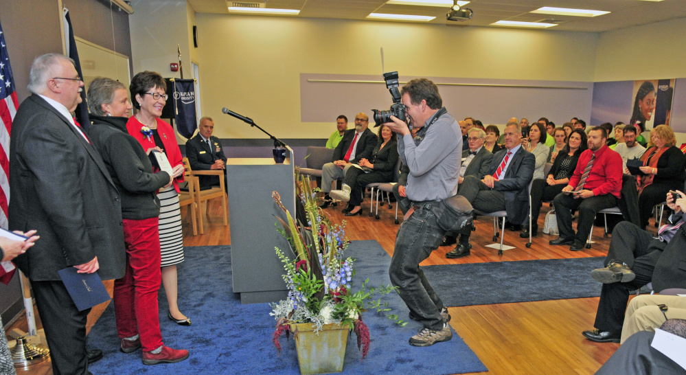 Staff photo by Joe Phelan
Marketplace at Augusta co-developer Roger Pomerleau, left; award-winner Renee Nelson, public and community service director for Townsquare Media, which runs local radio stations 92 Moose and B98.5; and U.S. Sen. Susan Collins pose for a photo Saturday during an awards ceremony at Kaplan University in Augusta.