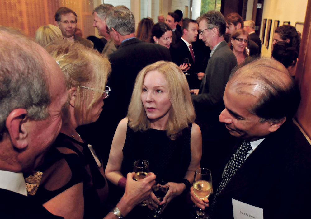 Journalist Katherine Boo was the center of attention during a reception at Colby College in Waterville on Monday. Boo later received the Elijay Lovejoy award.