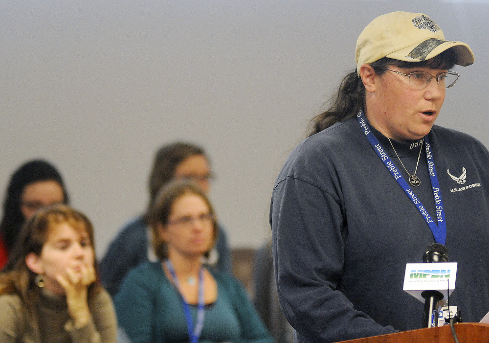 Veterans advocate Keri Dunton speaks against a proposal by the Department of Health and Human Services to conduct asset tests on people receiving state-administered aid during a hearing Tuesday in Augusta. An Air Force veteran from Bangor, Dunton works for Preble Street Veteran Services.