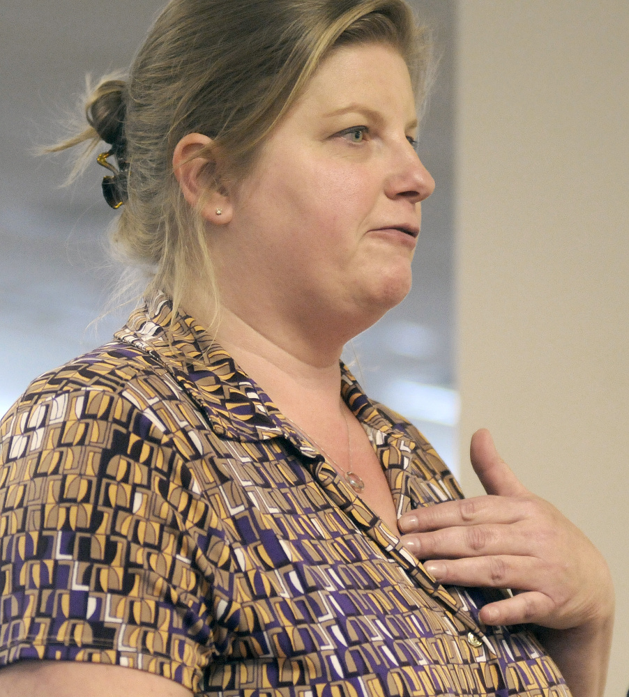Beth Drugach, of Saco, speaks in favor of a state proposal to conduct asset tests on people receiving state-administered aid during a hearing Tuesday in Augusta.
