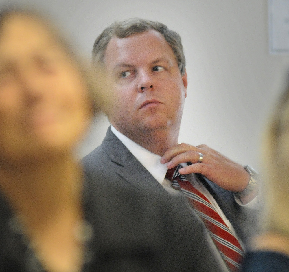 David Sorenson, spokesman for the Department of Health and Human Services, listens to testimony Tuesday during a hearing in Augusta about the agency’s proposal to conduct asset tests on people receiving state-administered aid.