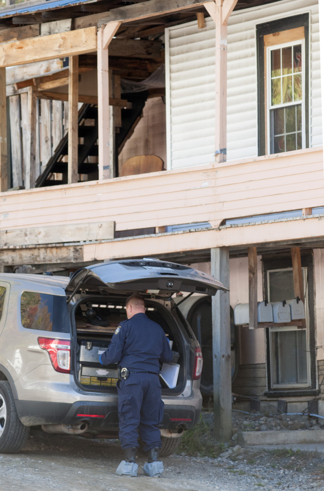 A Maine State Police Trooper works at 95 Mount Vernon Ave. in Augusta on Thursday.