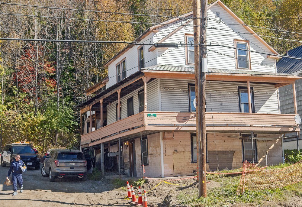 Investigators work at 95 Mount Vernon Ave. in Augusta on Thursday.