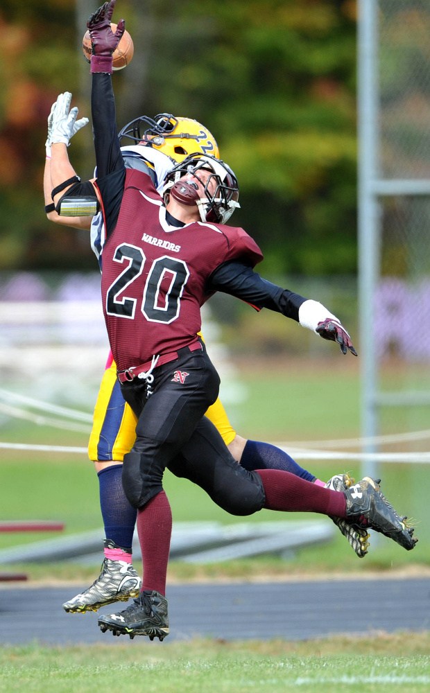 Nokomis High School’s Colby Penette (20) breaks up a pass intended for Mt. Blue High School’s Zach Meader (22) on Saturday in Newport.