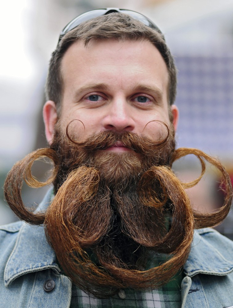 Bryce Royal, of Windham, competes in the beard contest during the Swine and Stein festivities on Saturday on Water Street in downtown Gardiner.