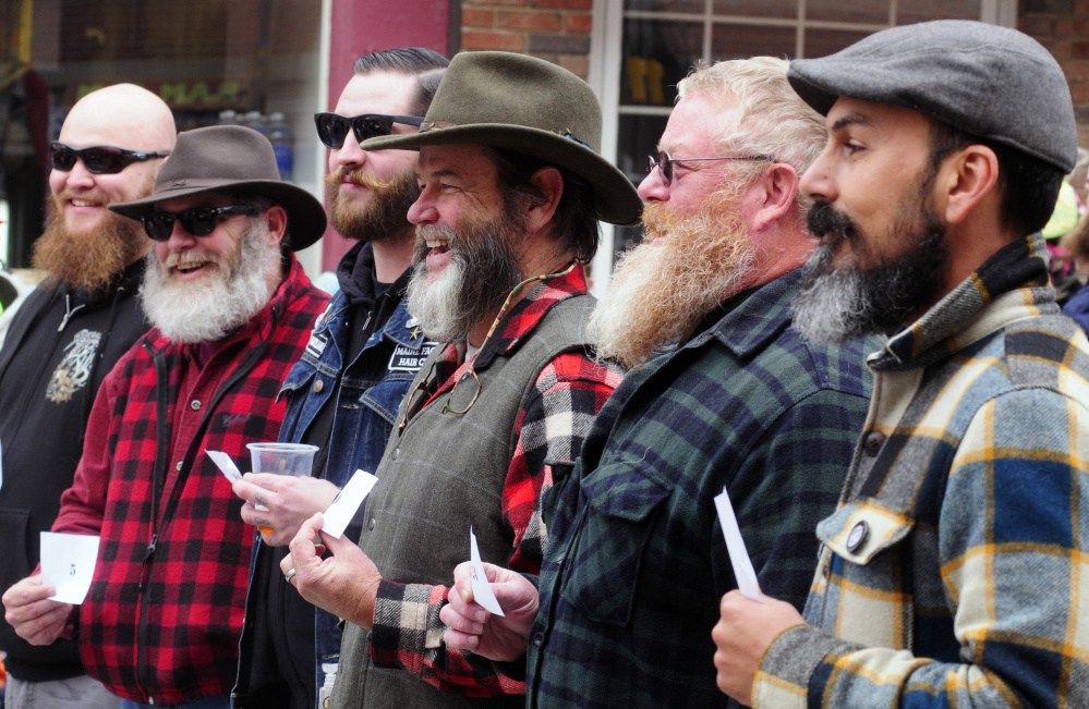 Competitors stand before judges during the Swine and Stein festivities on Saturday on Water Street in downtown Gardiner.