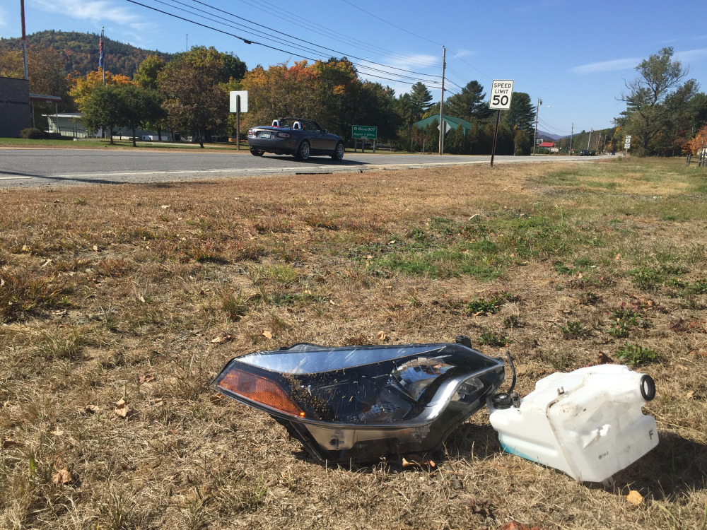 Debris from the accident that killed Paul Stucki of Winslow remains on the side of U.S. Route 2 in Dixfield on Monday.