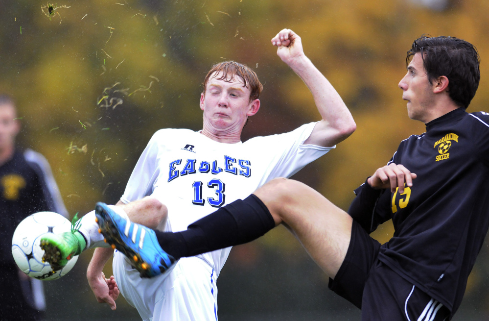 Staff photo by Andy Molloy 
 Maranacook's Carlo Bozzola, right, goes foot-to-foot with Erskine's Brock Glidden during a Class B game Tuesday in South China. Maranacook won, 2-1.