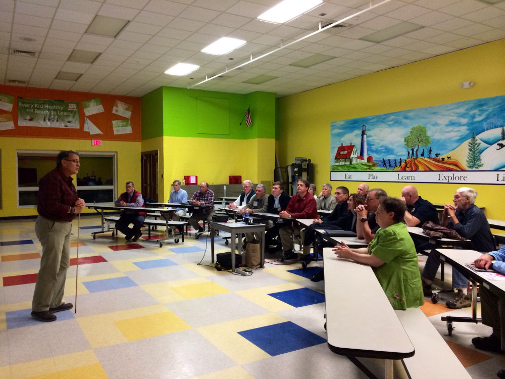 Oakland Town Manager Gary Bowman answers residents questions about a new police station being proposed at a public hearing on Thursday.