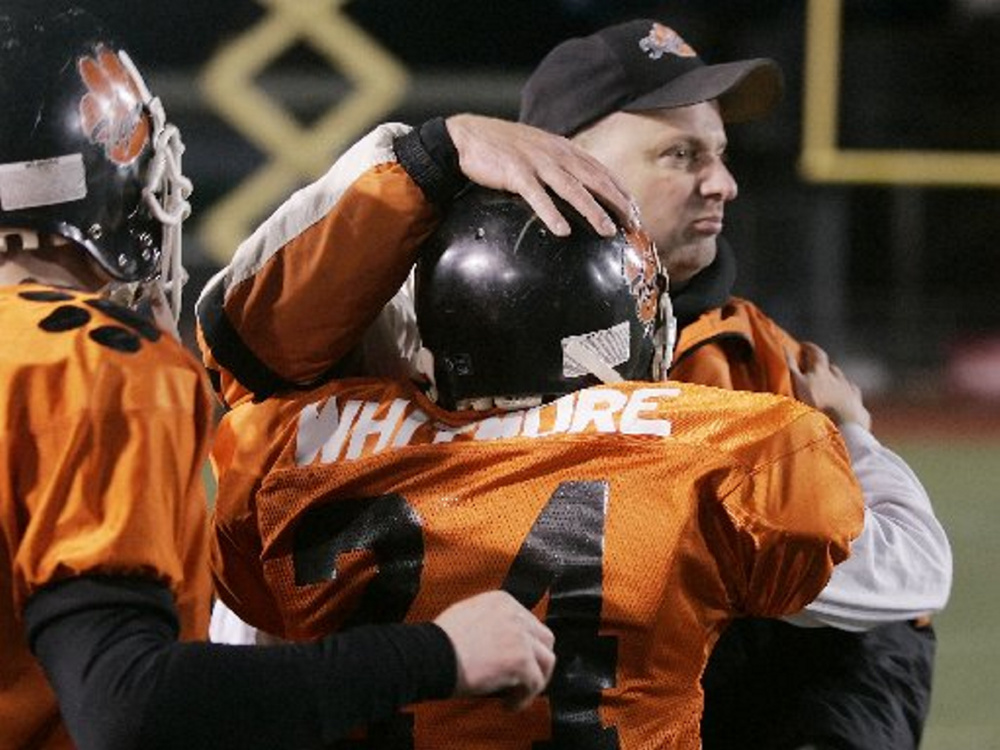 Staff file photo by Andy Molloy 
 Former Gardiner coach Matt Brown celebrates with his players after his team defeated Mountain Valley in the Class B state title game on Nov. 17, 2007.