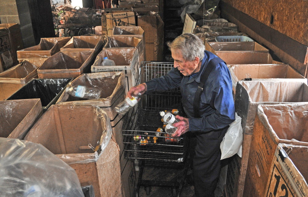 Sonny Gamache works at the Randolph Redemption Center on Thursday in Randolph. Gamache has been a fixture at Gardiner Area High School football games for about 60 years.