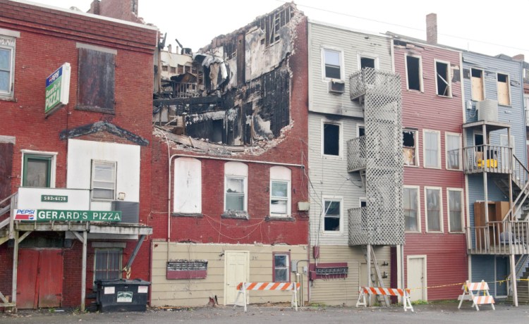 This Thursday photo shows the collapsed roof on 235 Water St. in Gardiner that was heavily damaged by a fire earlier in the year.