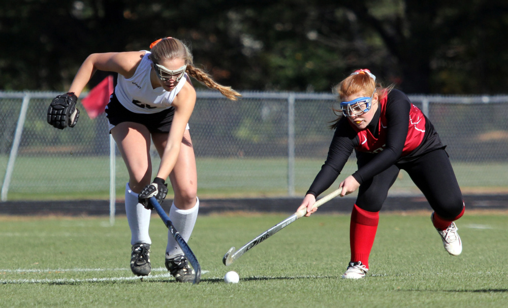 Photo by Jeff Pouland 
 Skowehegan's Elizabeth York and Cony's Cari Hopkins battle for the ball during the first half of a Class A North seminfinal Saturday in Skowhegan.