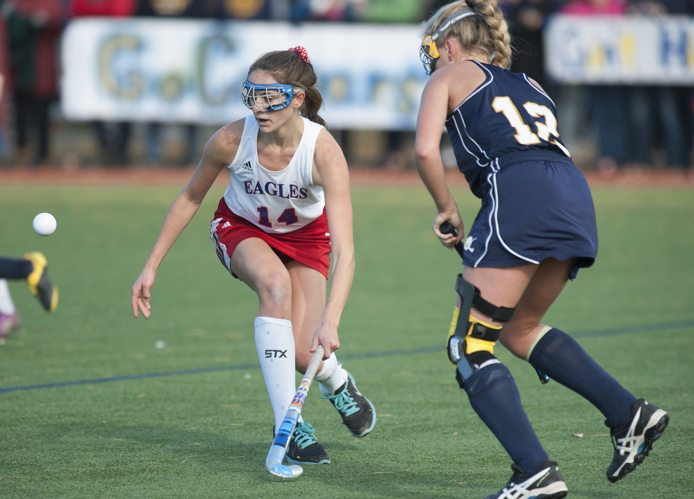 Kevin Bennett photo 
 Messalonskee’s Haley Lowell, left, attempts to block a pass by Mt. Blue’s Rebecca Harnom during the first half of a Class A North semifinal game Saturday at Thomas College. The top-seeded Eagles won 6-0.