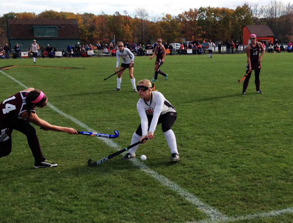 Staff photo by Evan Crawley 
 Cailin Seavey, of Foxcroft, left, tries to get the ball past Winslow's Cassidy Rickard during a Class B north semifinal game Saturday in Winslow. The Black Raiders won 2-0.
