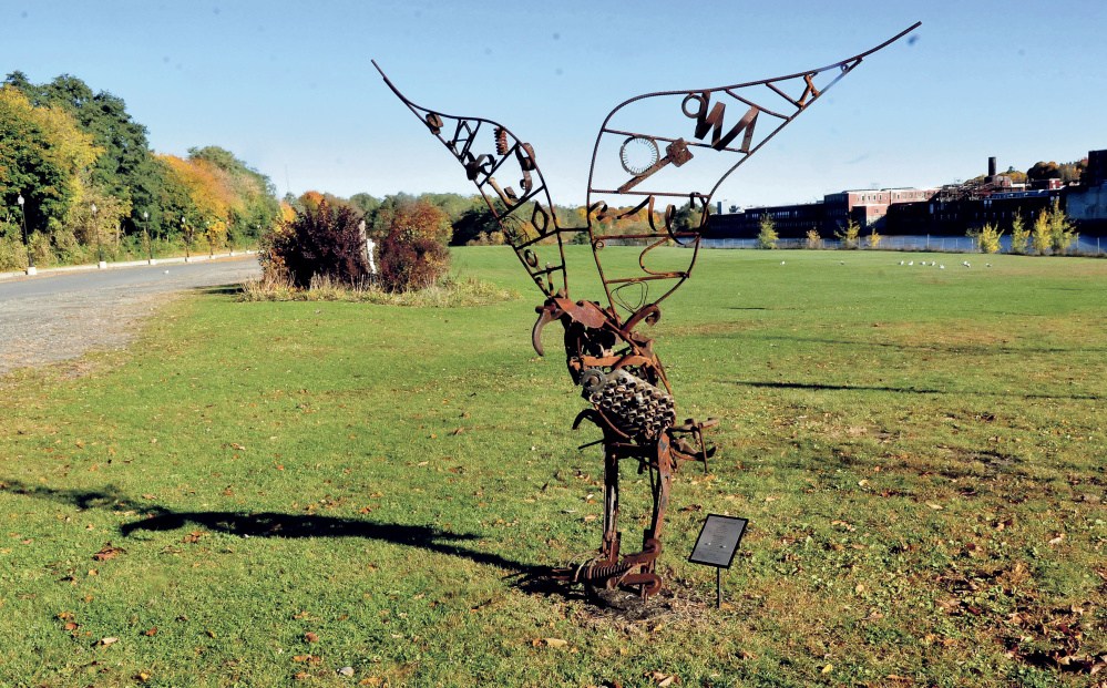 An osprey sculpture and real seagulls dominate Head of Falls area Monday in Waterville. City officials are discussing possibilities for development at the riverside property.