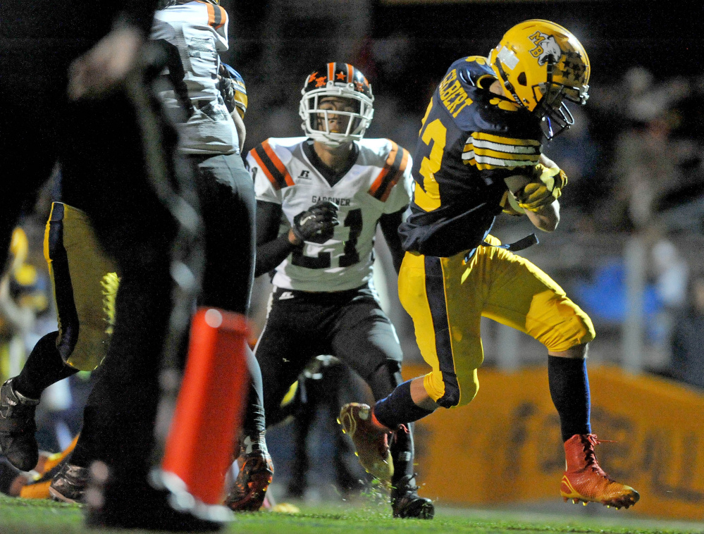 Mt. Blue High School’s Alex Gilbert (23) trots into the end zone for a touchdown during a Pine Tree Conference Class B game earlier this season at Caldwell Field in Farmington.