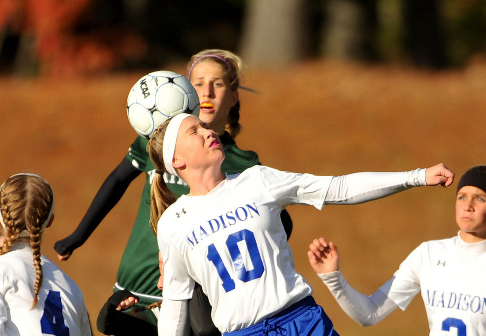 Madison’s Madeline Wood (10) gets the header against Waynflete during a Class C South semifinal game Friday in Madison.