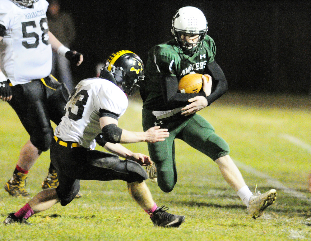 Maranacook’s Drew Davis, left, Winthrop/Monmouth’s Matt Ingram out of bounds during a Campbell Conference Class D quarterfinal game against Friday night at Maxwell Field in Winthrop.