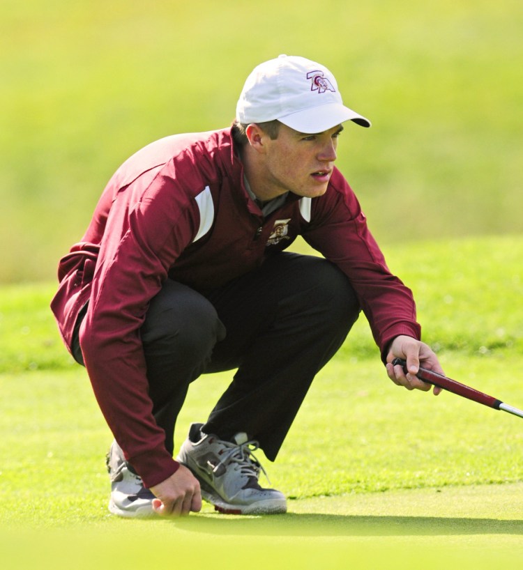 Thornton Academy's Greg Kalagais lines up a putt during state championship golf tournament Saturday at Natanis Golf Club in Vassalboro. Joe Phelan/Staff Photographer