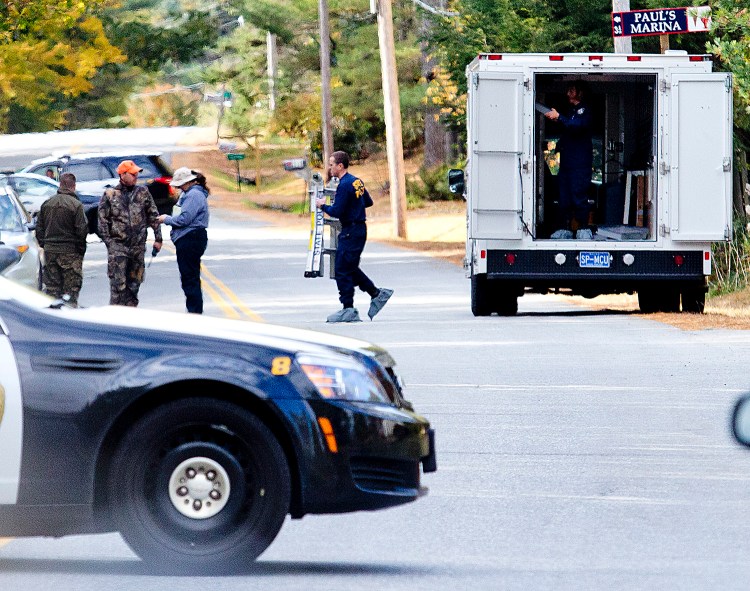 The Maine State Police crime scene unit was on hand to help process the scene off Maquoit Road in Brunswick where Lisa Marie Cox, who was missing since Monday night, was found hanging from a tree. Gabe Souza/Staff Photogrtapher
