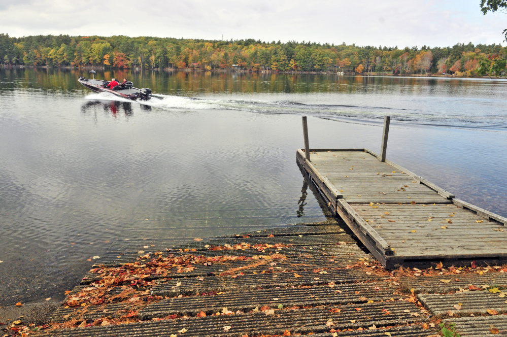 Dan Roy Sr. and Dan Roy take off for a day of bass fishing last month on Cochnewagon Lake in Monmouth, where voters on Tuesday approved spending money on improvements.