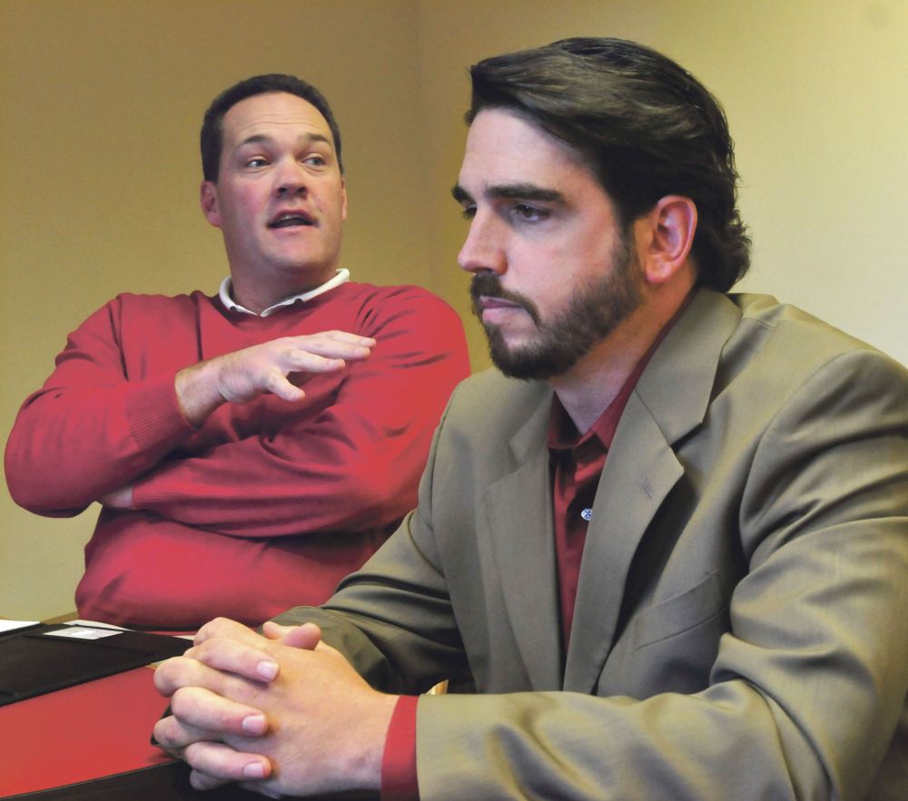 Attorney Gregg Frame, left, and his client, Waterville Senior High School Principal Don Reiter, speak with the Morning Sentinel about Reiter’s upcoming public hearing with the Board of Education over whether he should be dismissed from his job.
