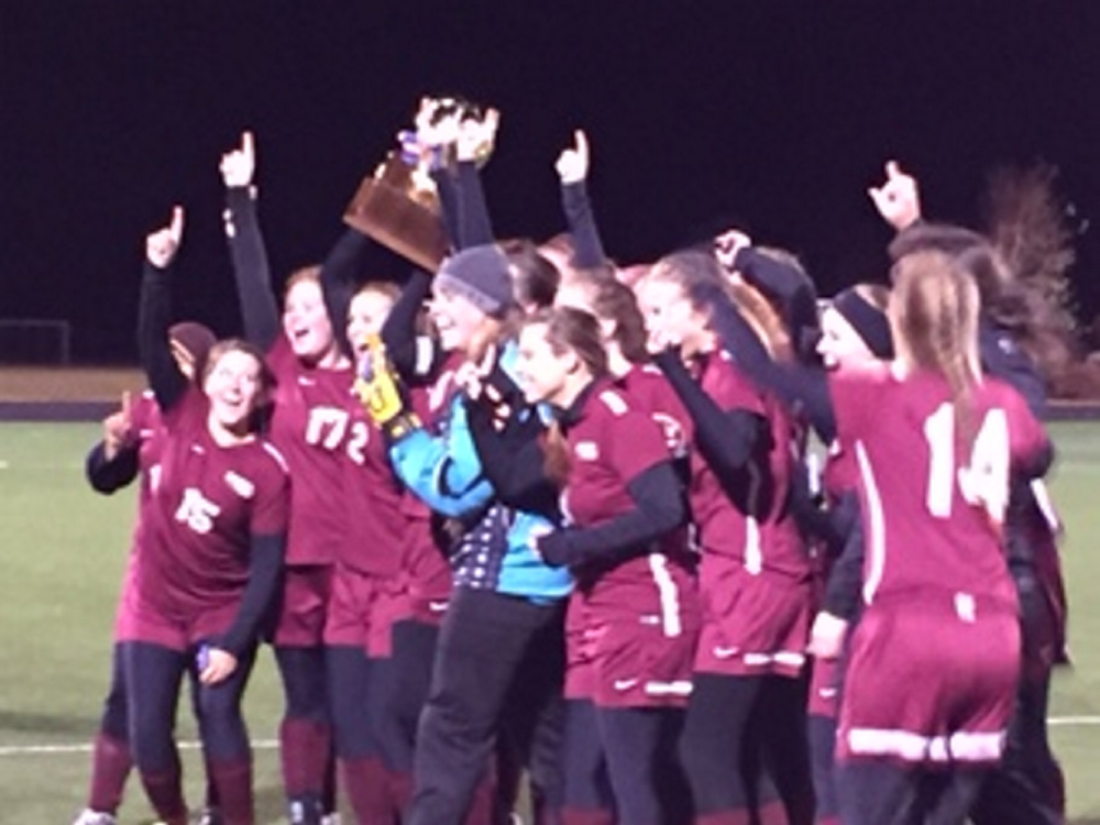 Members of the Richmond girls soccer team celebrate after winning the Class D Girls Soccer championships over Ashland Saturday in Presque Isle. The Bobcats beat Ashland 1-0.