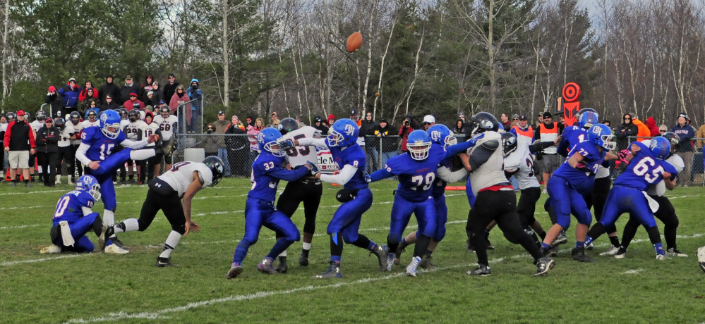 Oak Hill kicker Steve Gilbert make an extra point during the Campbell Conference Class D title game against Lisbon on Saturday in Wales.