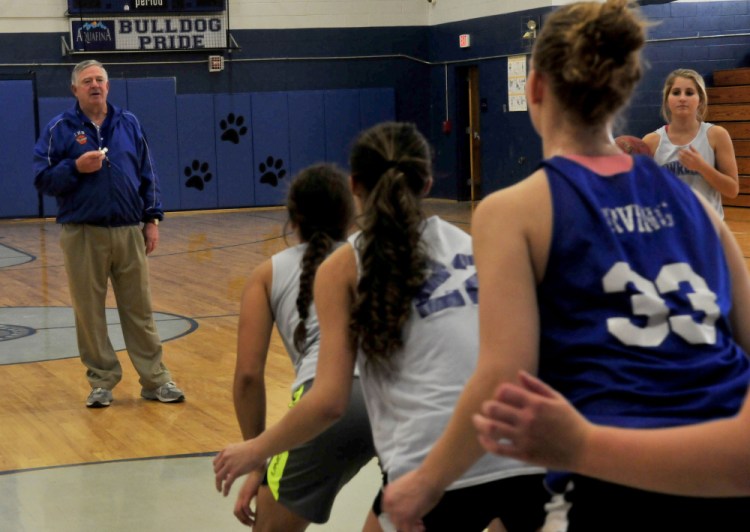 Staff photo by David Leaming
Lawrence head coach John Donato leads players during practice in Fairfield on Monday.