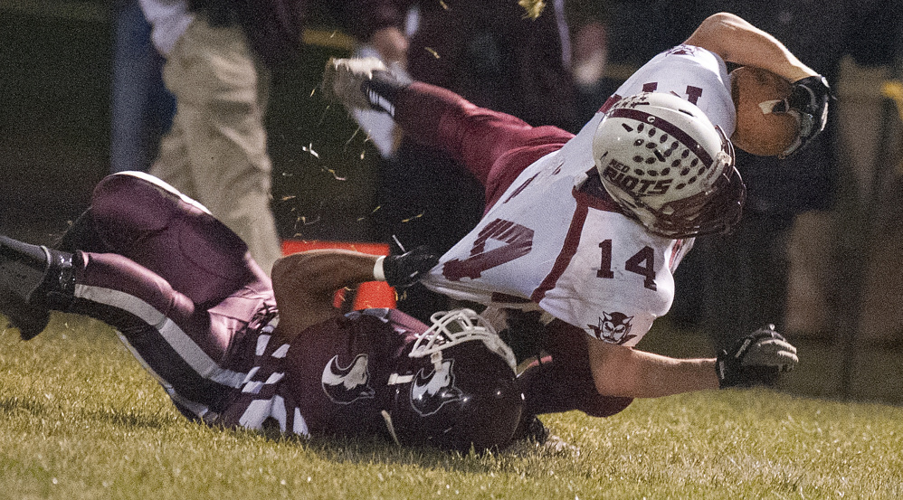 Maine Central Institute’s Willie Moss brings down Orono’s Josiah Grace during a Class D North semifinal earlier this month in Pittsfield.