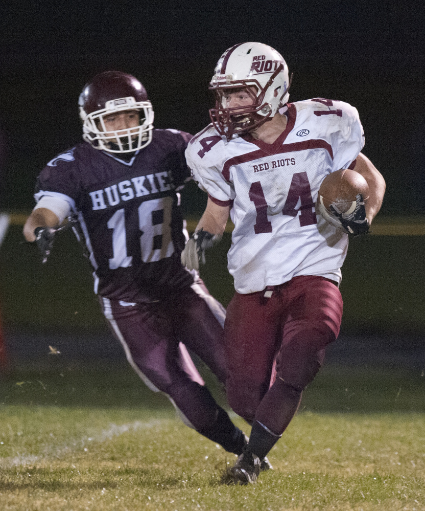 Maine Central Institute’s Braden Monteyro chases down Orono’s Logan Josiah Grace during Class D North semifinal earlier this month in Pittsfield.