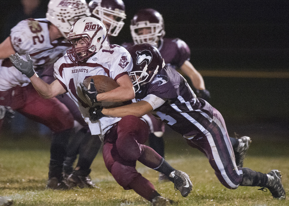 Maine Central Institute’s Braden Monteyro chases down Orono’s Logan Josiah Grace during a Class D North semifinal earlier this month in Pittsfield.