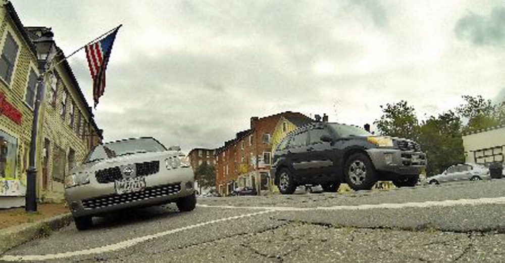 The slope of Water Street in Hallowell, caused by a raised crown in the middle of the road, makes it difficult for customers who park on the east side of the street.