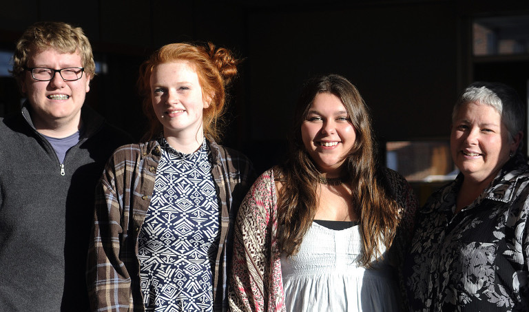 Gardiner Area High School students Josh Mathews, Melanie Mansir, center, and Jillian Moore with their Civil Rights Team adviser Christina Benedict on Nov. 16 at the Gardiner school. The students want to add socioeconomic status to anti-bullying regulations at the school.