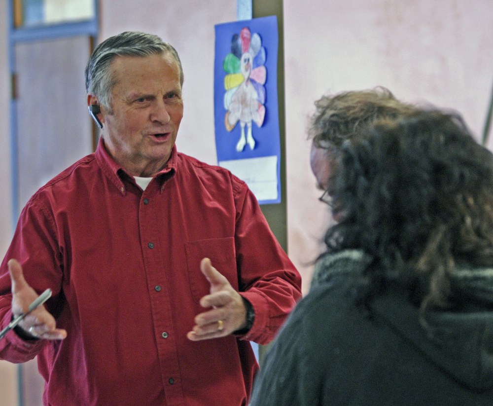 Joe Atkinson organizes meal deliveries during the community Thanksgiving dinner put on by the Augusta Valley Scottish Rite Masons at Gardiner Area High School on Thursday.