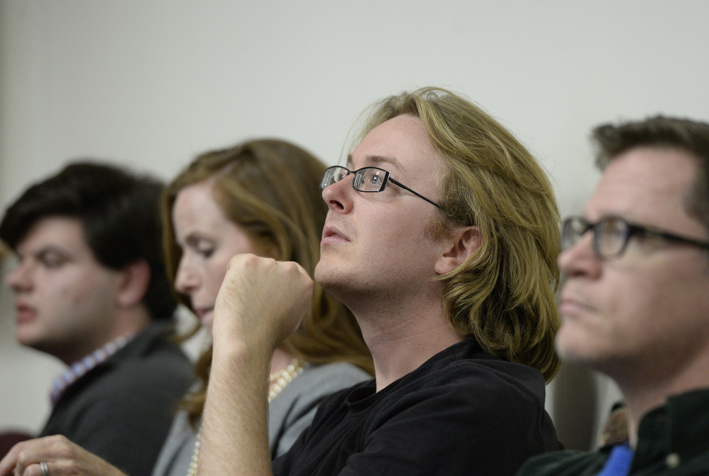 Mako Bates, one of the Green activists who supports raising the minimum wage, watches for results at Portland City Hall on Tuesday.
Shawn Patrick Ouellette/Staff Photographer