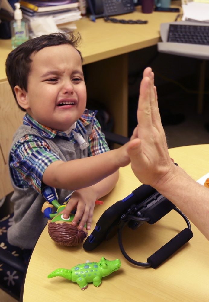 Grant Hasse gives his doctor a high-five. Andrea Hasse, Grant’s mom, was pregnant for 18 weeks when she learned Grant had cartilage in his airway that was causing swelling in his lungs.